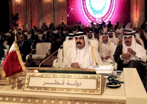 Emir of Qatar Sheik Hamad Bin Khalifa Al Thani, center, attends the opening session of the Arab League Summit in Doha, Qatar, Tuesday, March 26, 2013. Photo: AP