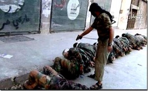 A Jabhat al-Nusrah fighter executes Shia Alawites in Syria.