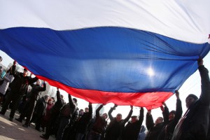 Pro-Russian protesters wave a Russian flag during a rally in the industrial Ukrainian city of Donetsk on March 1, 2014