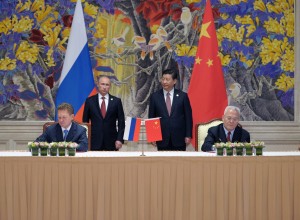 China signed a long-awaited, 30-year deal on May 21, 2014 to buy Russian natural gas worth 400 billion US dollars in a financial boost to the diplomatically isolated Russian President Vladimir Putin. [Russia's President Vladimir Putin, background left, and China's President Xi Jinping, background right, Russian Gazprom CEO Alexei Miller, foreground left, and China's CNPC head Zhou Jiping, foreground right]