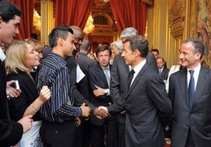 Nicolas Sarkozy, then French president, shaking hands with Amedy Coulibaly, a terrorist who killed one policeman and four shoppers in a kosher supermarket in Paris early January 2015. This handshake took place on July 15 2009, at an official event at the Elysee palace, organised to promote apprenticeships for youth.