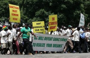 Supporters of the Zimbabwe African National Union's Patriotic Front (ZANU-PF) march in the streets of Harare February 24, 2010, to protest against the decision by the European Union to extend economic sanctions on Zimbabwe for another year. REUTERS/Philimon Bulawayo