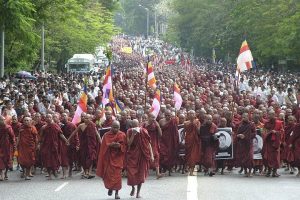 Buddhist monks march on a street in protest against the military government in Yangon, Myanmar, Nov 2011