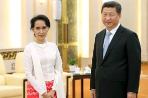 Aung San Suu Kyi and China's President Xi Jinping in Beijing in June 2015