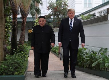 U.S. President Donald Trump and North Korea's leader Kim Jong Un walk in the garden at the Metropole hotel during the second North Korea-U.S. summit in Hanoi