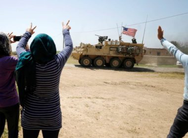 Kurds wave US troops