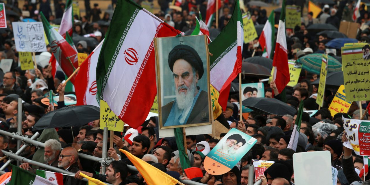 Iranians attend a ceremony