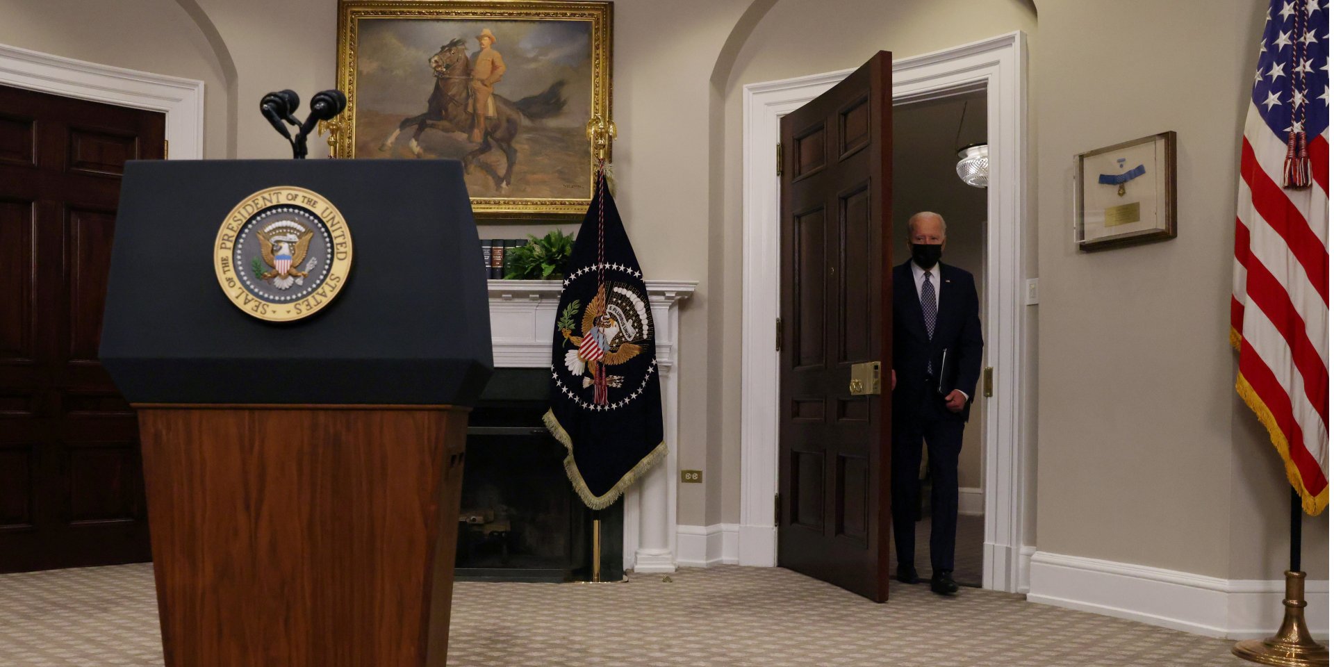 Biden behind the door