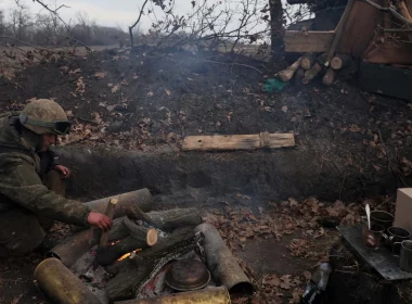 Ukrainian soldier at a fire